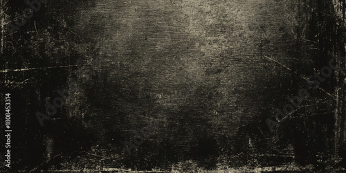 Abstract dark grunge texture with black and gray concrete wall and vignette effect details including scratches, cracks, peeling paint effects, dust particles.