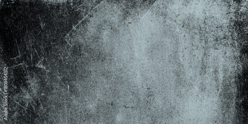 Abstract dark grunge texture with black and gray concrete wall and vignette effect details including scratches, cracks, peeling paint effects, dust particles.