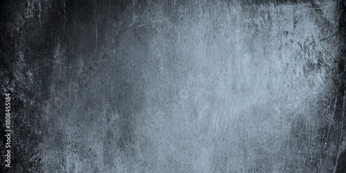 Abstract dark grunge texture with black and gray concrete wall and vignette effect details including scratches, cracks, peeling paint effects, dust particles.