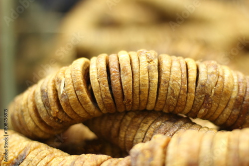 Dried figs texture background showing whole dehydrated anjeer fruit natural brown color closeup