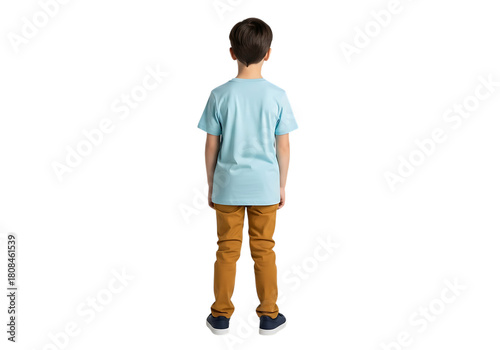 Young boy wearing a light blue t shirt and orange pants standing with his back to the camera isolated on transparent background