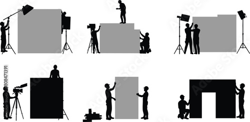 Film crew setting up stage backdrop and studio lighting, professional production teamwork, movie set construction, camera operators and technicians preparing scene