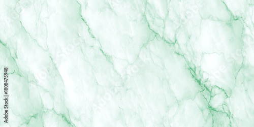 Soft mint green and gold alcohol ink texture abstract marble background wallpaper banner creating a luxurious, organic marble or stone like texture.