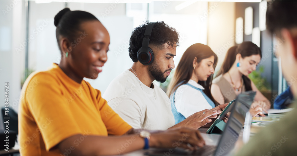 Obraz premium Classroom, university and students on tech for learning, studying and education at college. School, academy and people on tablet for research, website and internet for project, lesson and assignment