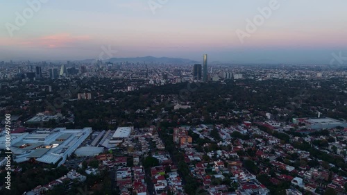 Twilight settling over southern Mexico City, aerial perspective