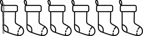 Six white socks lined up in a row on a