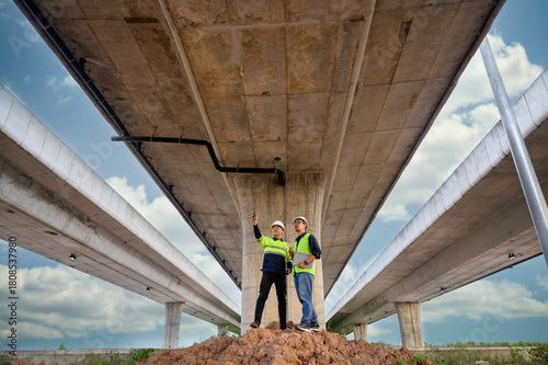 Wallpaper Mural Civil engineers inspect elevated highway structure at infrastructure construction site. Supervise new road construction, structural inspection, construction work in Thailand Asia. Torontodigital.ca