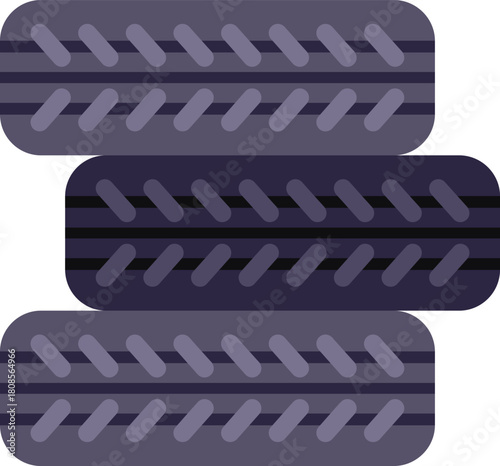 Set of three new tires are stacked on top of each other, ready for installation on a vehicle