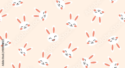 Cute and seamless pattern of smiling white bunny rabbit faces with various happy expressions on a soft pink background.