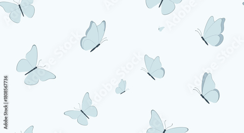 Delicate and seamless pattern of light blue butterflies fluttering gracefully across a pale blue background for a serene design.