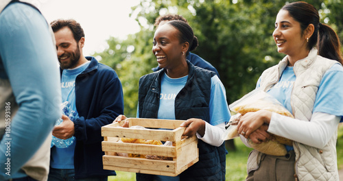 Food, donation and team of people in park for volunteer, community service or ngo project. Nonprofit support, grocery distribution and charity drive with men and women outdoor for outreach program