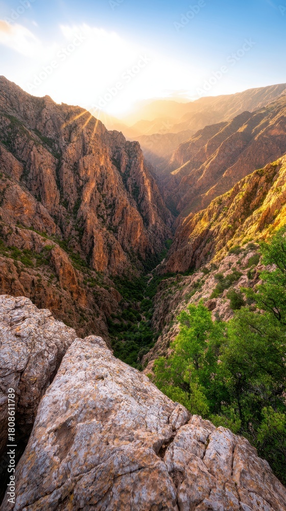Fototapeta premium Stunning Sunrise Over Majestic Canyon Landscape with Rocky Outcrops