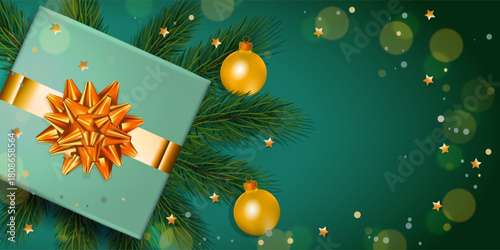 Christmas decorations with gift, balls and fur tree on green background. Mockup for your xmas design.