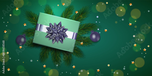 Christmas decorations with gift, balls and fur tree on green background. Mockup for your xmas design.