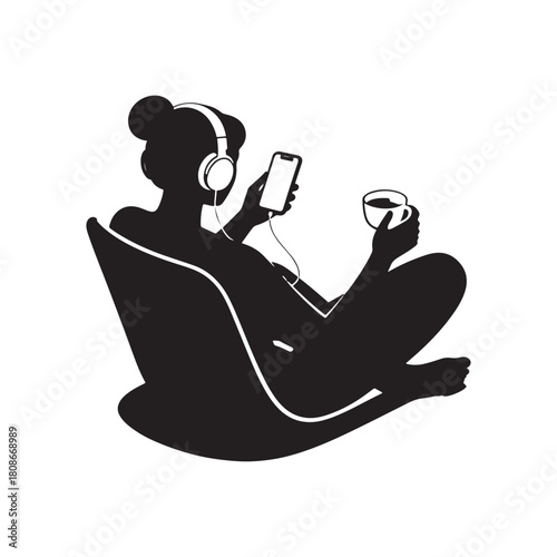 Silhouette of a person sitting relaxed with headphones and a cell phone in hand