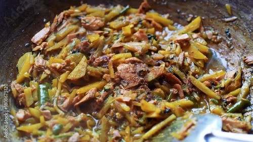 Cooked Vegetables and Shredded Meat in Pan, Close-up of a pan with cooked vegetables and shredded meat