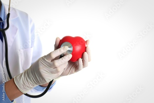 Doctor examines apple with stethoscope symbolizing healthy lifestyle