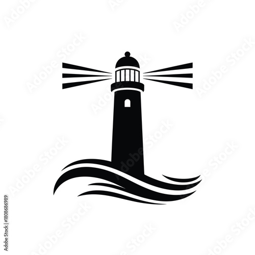 Black silhouette of a lighthouse shining light over waves