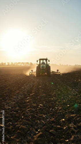 Golden Hour Tractor Plowing Agricultural Field Cinematic Footage