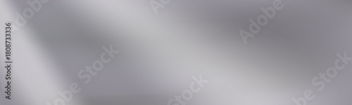Smooth silver mirror gradient background with soft blur. Gentle metallic reflections highlight the layered silver gradient tone.
