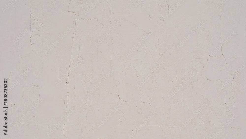 Obraz premium A textured wall surface showcases a neutral light color. The subtle variations in texture add depth, creating a calm and minimalistic feel in the space during midday hours