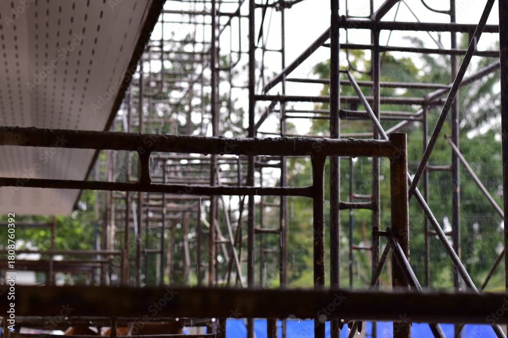 Obraz premium Scaffolding for building improvements, Renovation scaffolding enveloping historical building facade