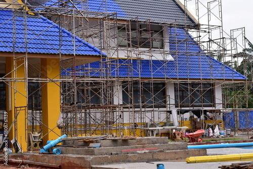 Scaffolding for building improvements, Renovation scaffolding enveloping historical building facade