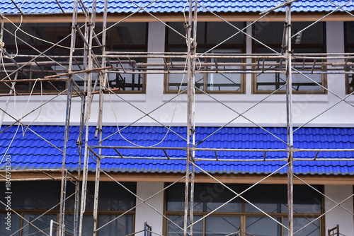 Scaffolding for building improvements, Renovation scaffolding enveloping historical building facade