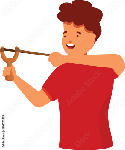Cheerful boy concentrating and aiming while using a wooden slingshot, playing and having fun outdoors