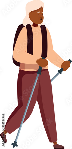 Active senior woman is using hiking poles while carrying backpack, enjoying outdoor activity and healthy lifestyle