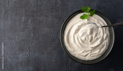 Traditional yogurt, full-fat or nonfat. Yogurt made from cow's or goat's milk on black background