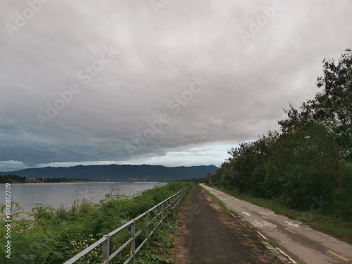 walkway along borderland on cloudy sky view background