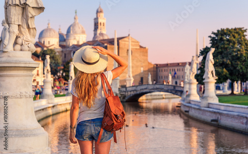Photos Young woman travel in Italy- Padua, Padova, Padoue city, river and bridge- Prato