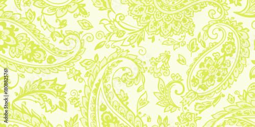 A beautiful and intricate lime green paisley pattern with detailed floral ornaments on a pale yellow background, a classic seamless repeat design for textiles