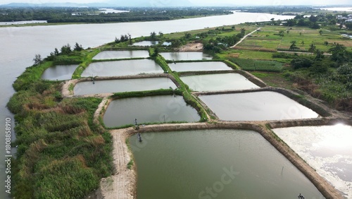 Asia , Vietnam , Hoi An - Rice fields along the Thu Bon River filled with water ready for rice plants to grow
