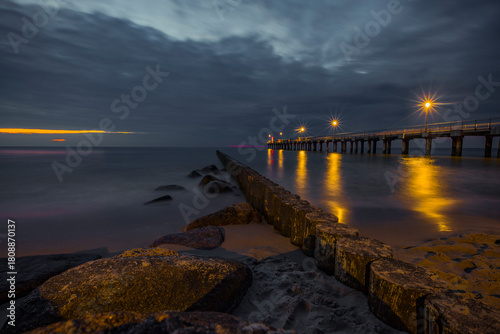 Fototapeta Naklejka Na Ścianę i Meble -  Pier in the evening after sunset in the Baltic Sea