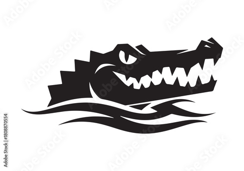 A menacing alligator head emerges from the water, showcasing its sharp teeth isolated on