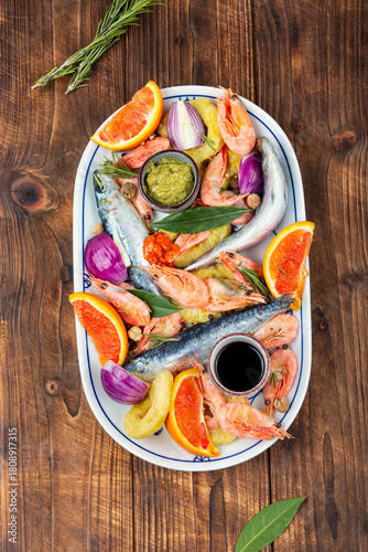Plate with raw marinated seafood.