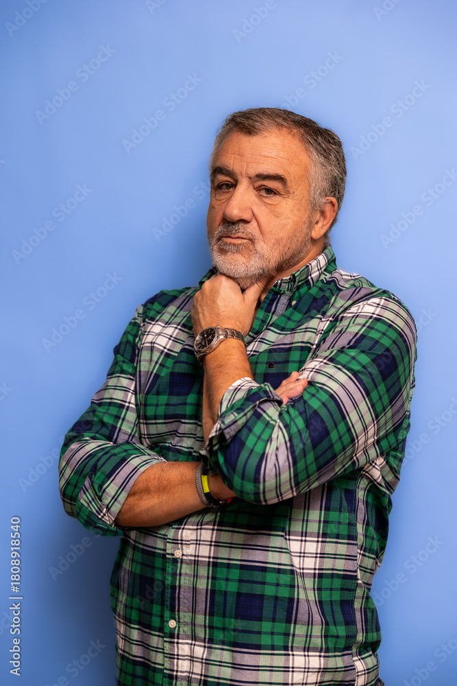 Fototapeta premium Mature man thinking seriously with hand on chin