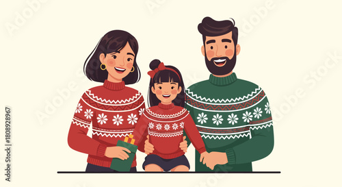 A happy family of three, a mother, father, and daughter, wearing matching festive Christmas sweaters and smiling together.