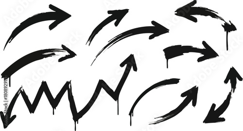 Grunge black brush stroke arrows set showing dynamic movement and financial trends