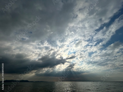 Sun under the clouds at the sea
