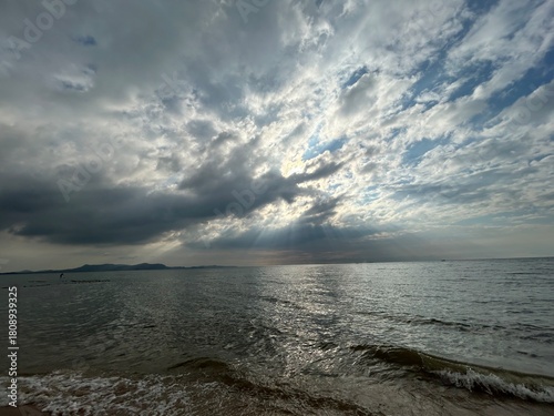 Sun under the clouds at the sea
