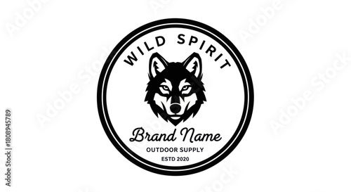 A circular logo design featuring a wolf's head and brand information.