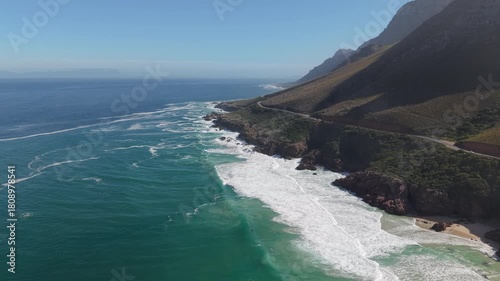 Waves Crashing On The Rocky Shores Of Chapman's Peak Drive Near Cape Town In South Africa. Aerial Drone Shot