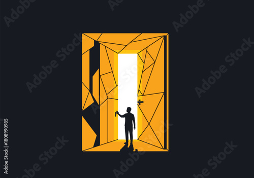 Silhouette of a man opening geometric door with bright light contrast