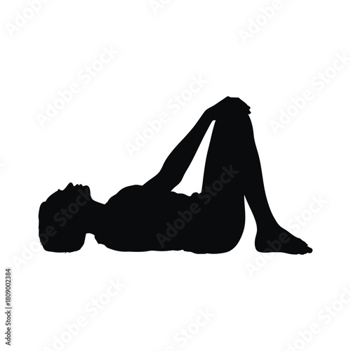 Silhouette of a woman in supine position isolated on, knees bent towards chest, showcasing a gentle yoga posture for relaxation