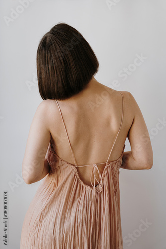 Woman in Dress with Bare Back Indoors