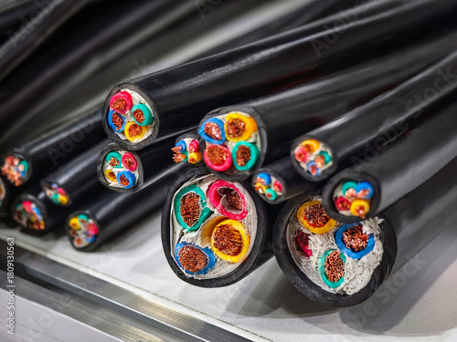 Variety of electrical wires and cables showing different colors and types in a detailed view on the workbench