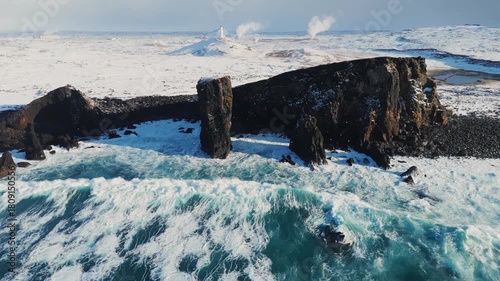 Wallpaper Mural Aerial view of waves breaking on the snowy cliffs along the coast storm ocean sea on sunrise in winter Torontodigital.ca